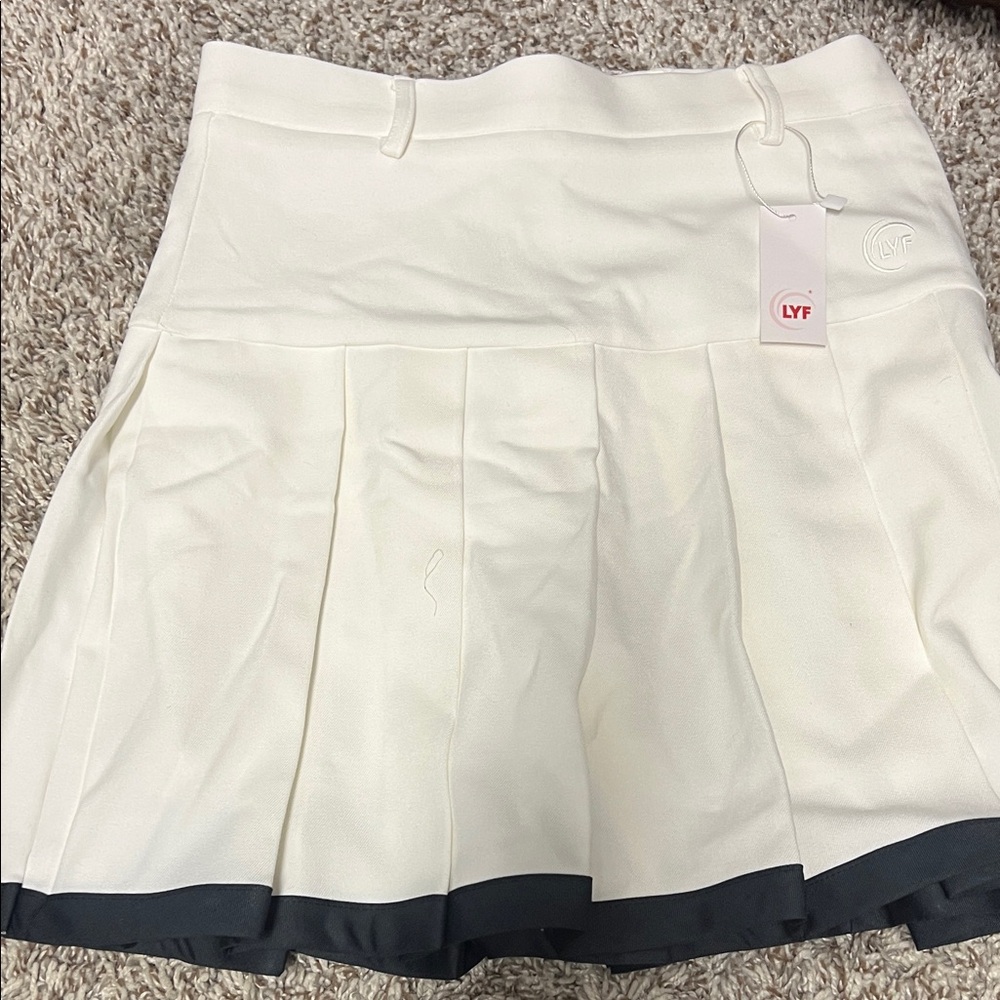 White Pleated Skirt with Black Trim
